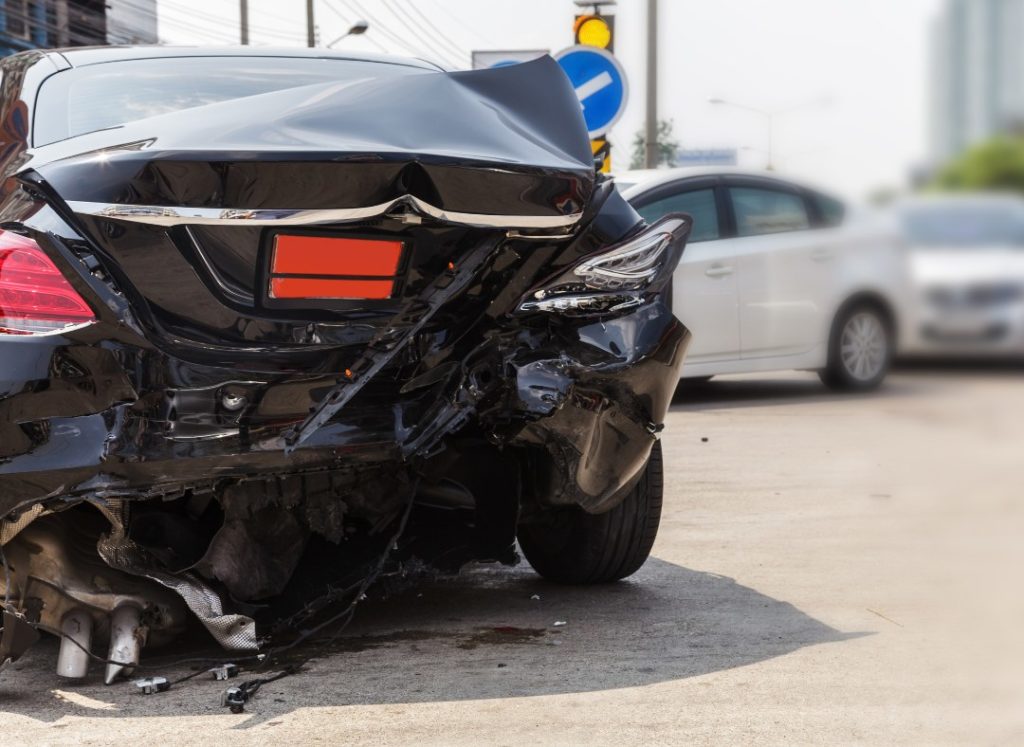 Black car accident on the road. Reviving Beauty:A Deep Dive into the Art and Science of Collision Repair