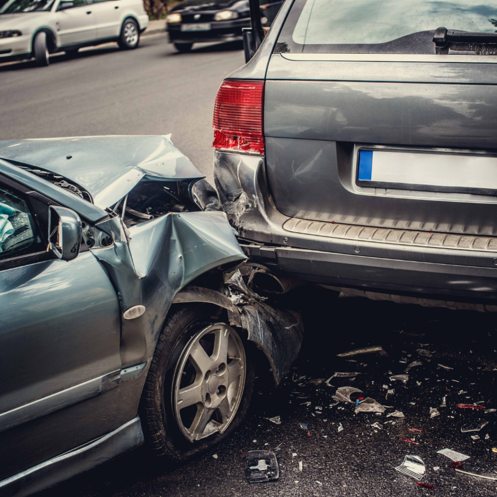 Two vehicles involved in a rear-end collision, showing significant damage.